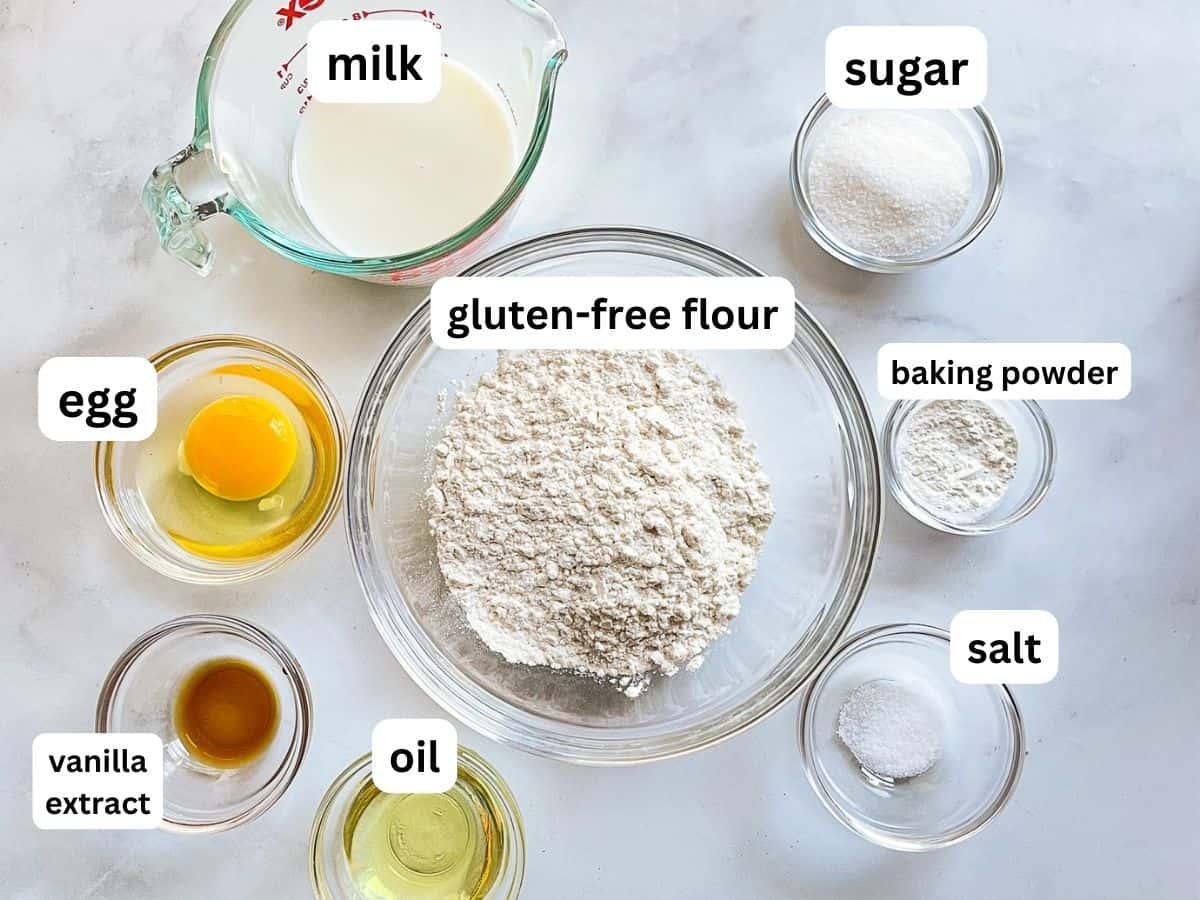 Gluten-free pancake ingredients in bowls on the counter.