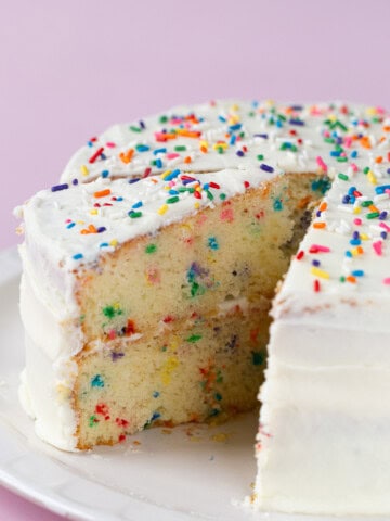 Gluten-free confetti cake on a cake plate.