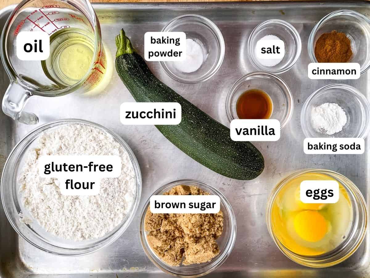Ingredients for gluten-free zucchini bread on a sheet pan.