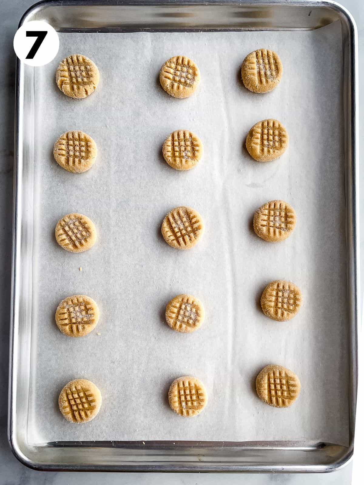 Gluten-free peanut butter cookie dough on a baking sheet.