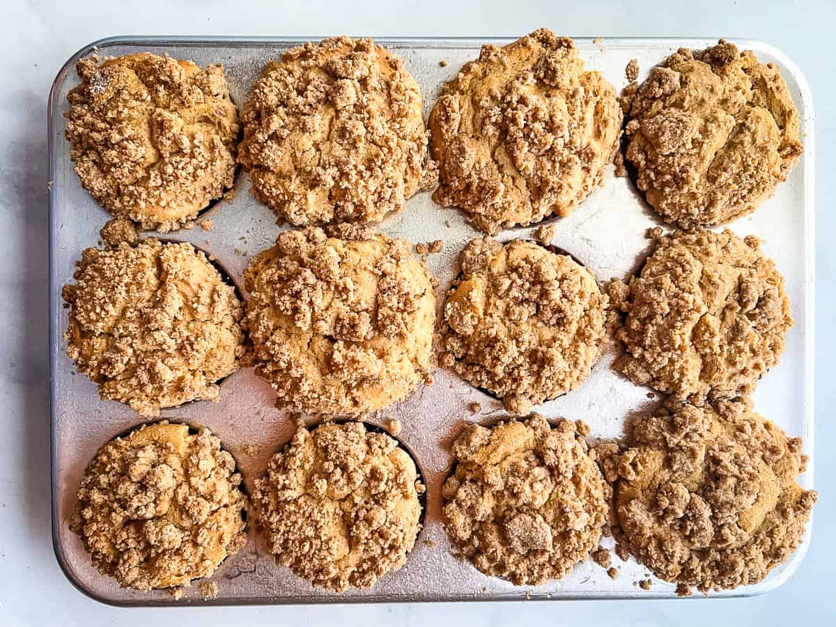 Gluten-free apple muffins cooling in the pan.