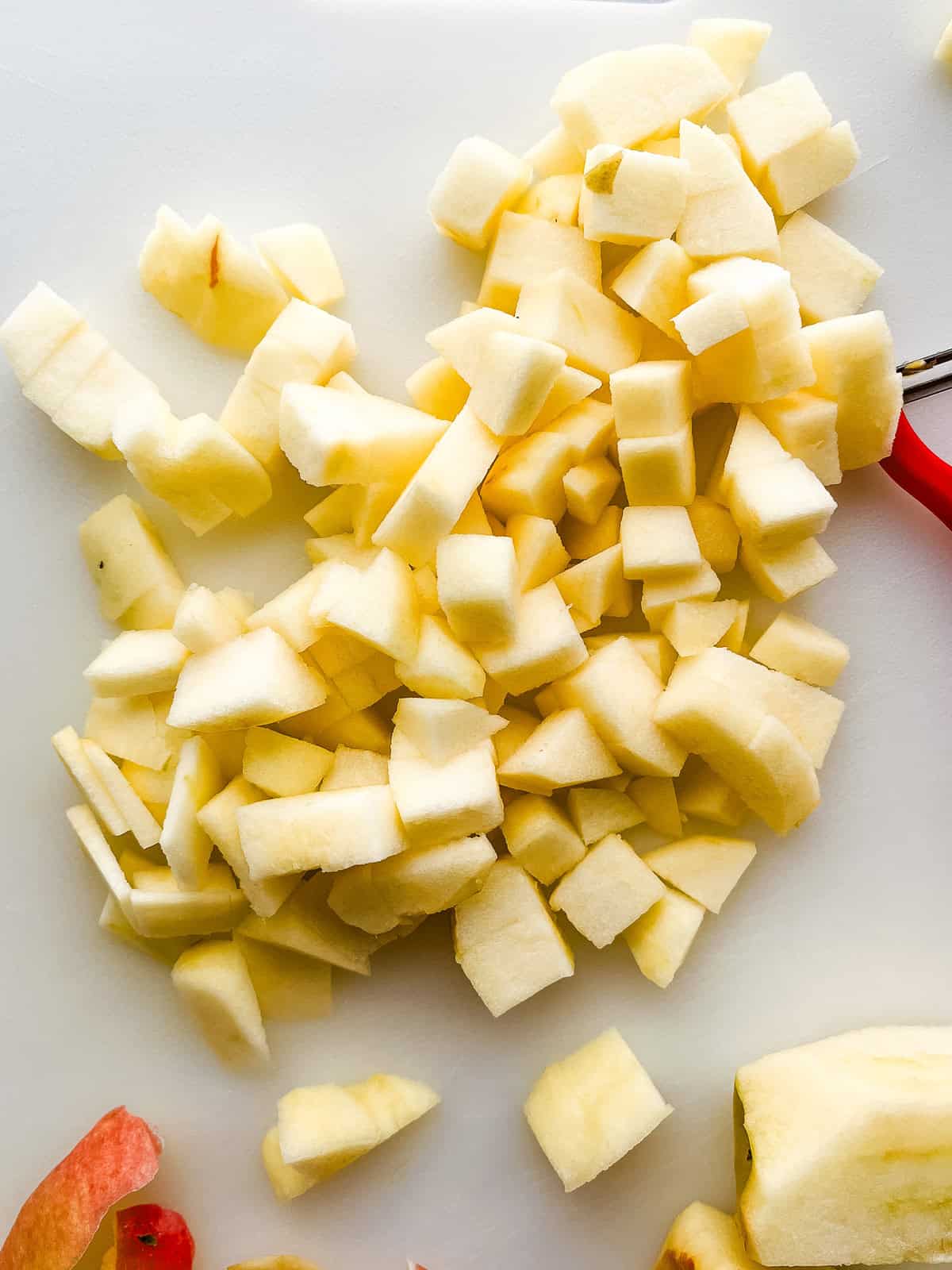 Diced apples for gluten-free apple muffins.