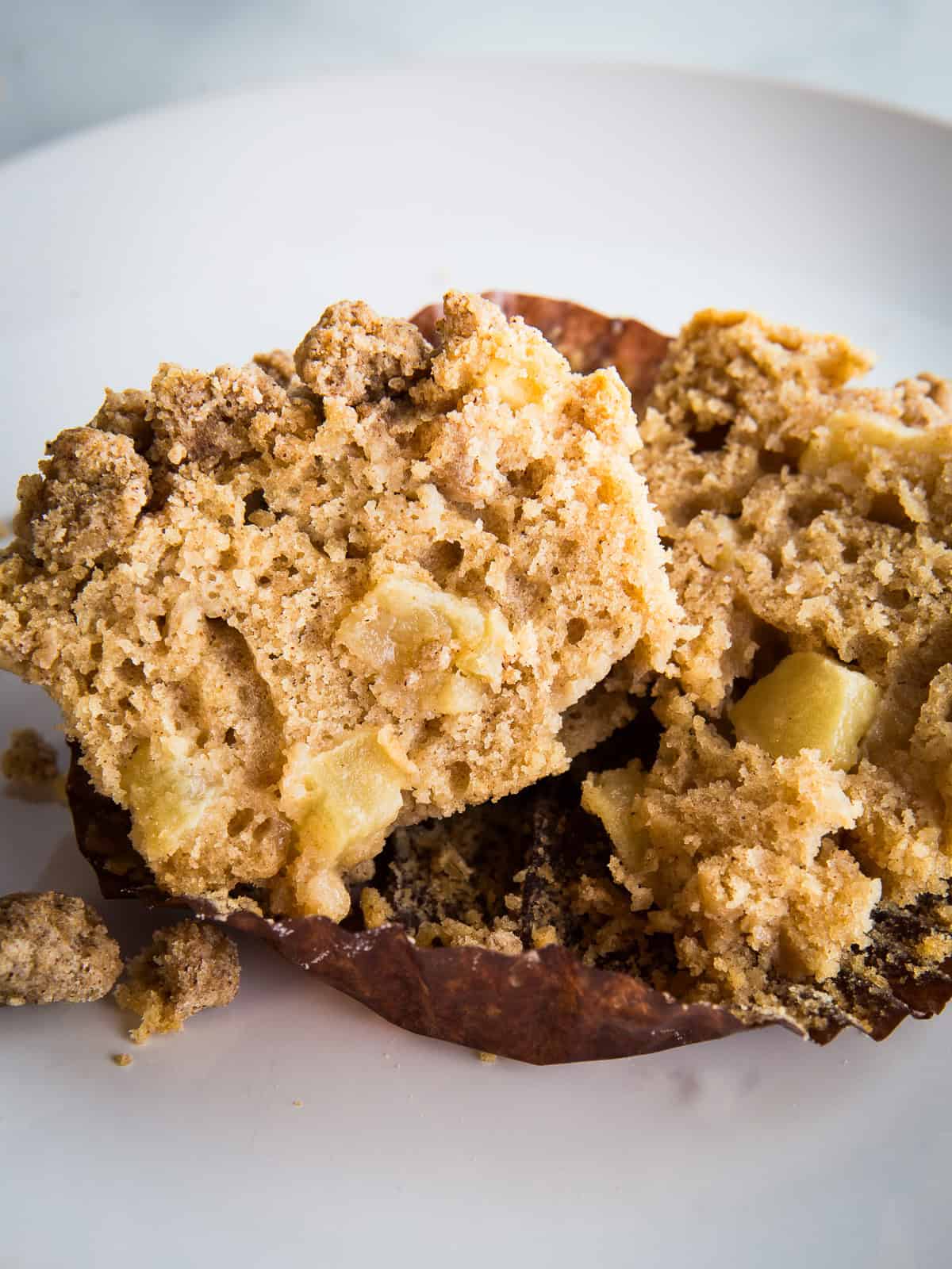 Gluten-free apple muffin split in half.