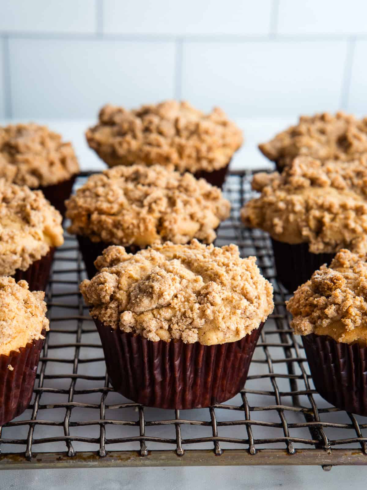 Gluten-free apple muffins on a cooling rack.