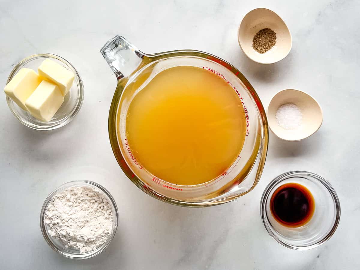 Ingredients for gluten-free gravy measured and in bowls on the counter.