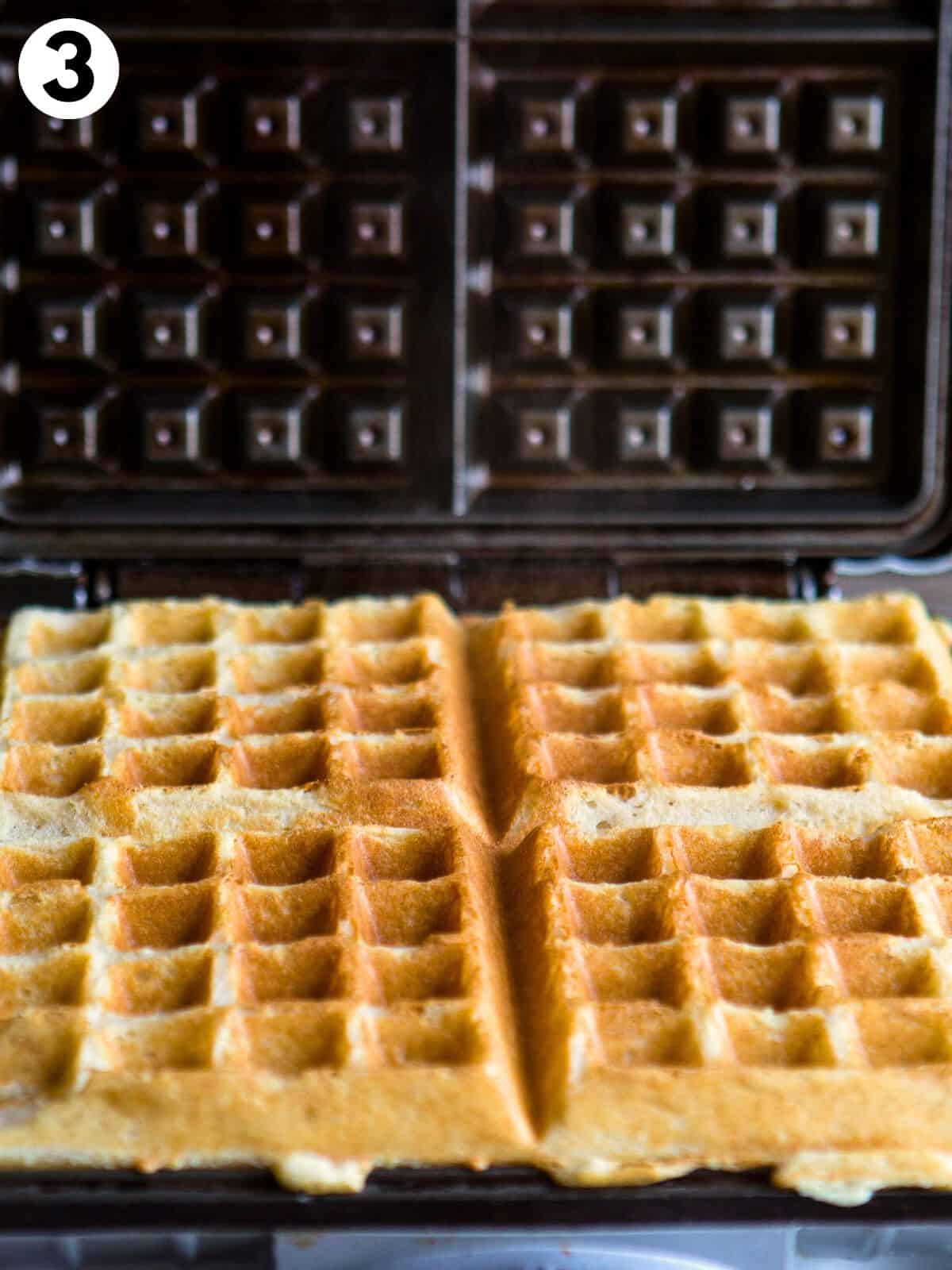 Gluten-free waffles in a waffle iron.