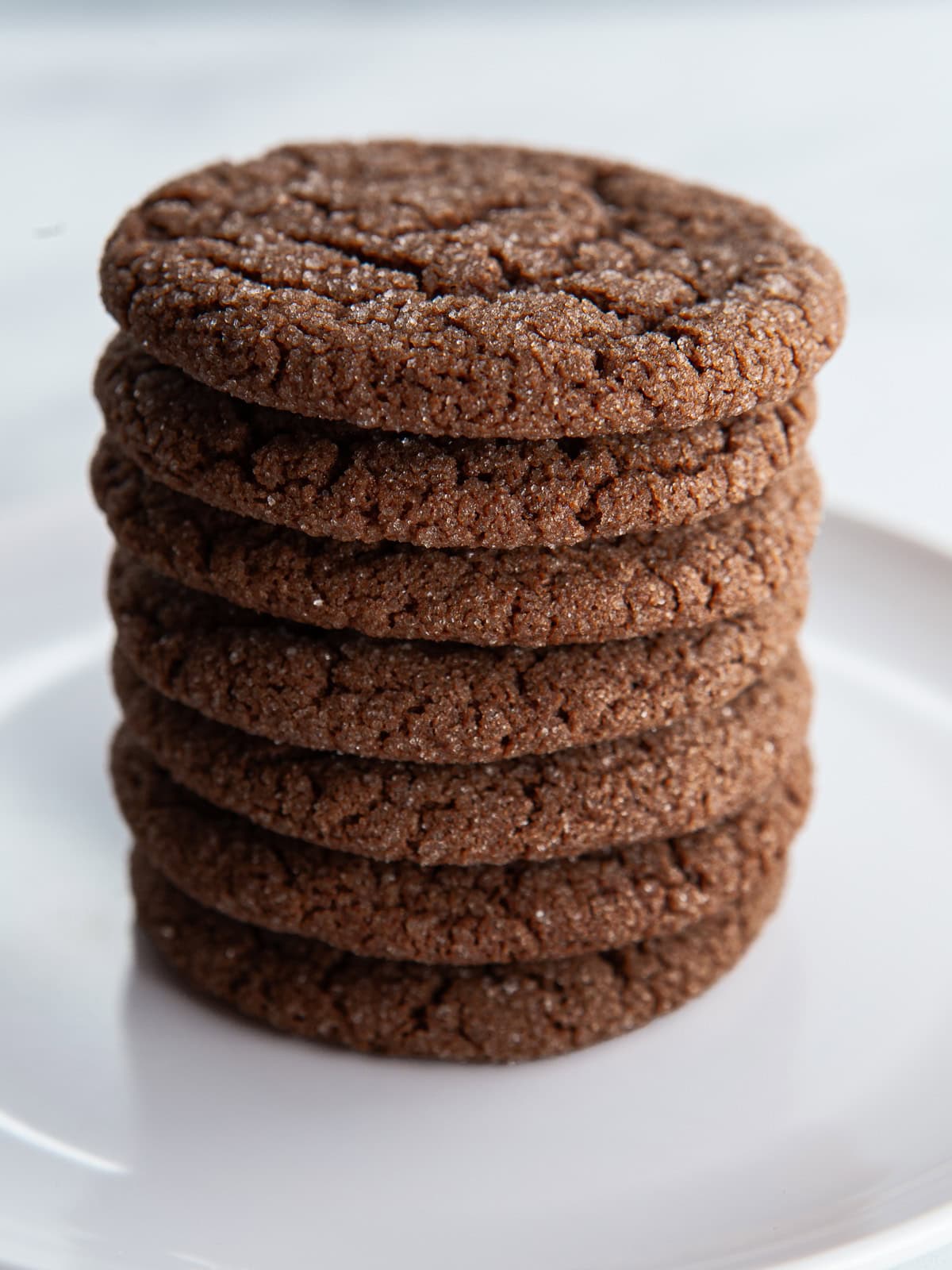 Gluten-free chocolate sugar cookies in a stack.
