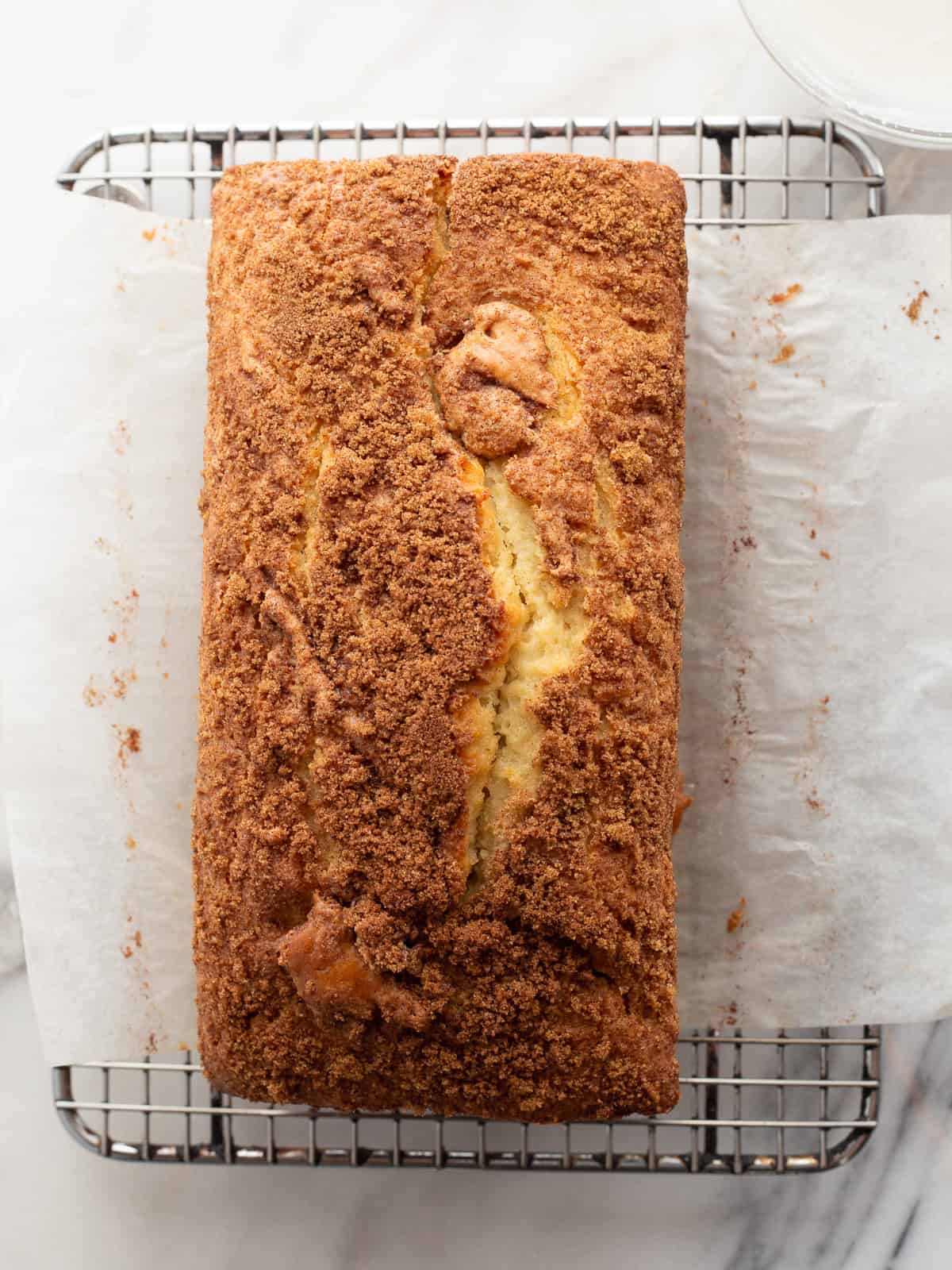 Gluten-free cinnamon swirl bread on a cooling rack.