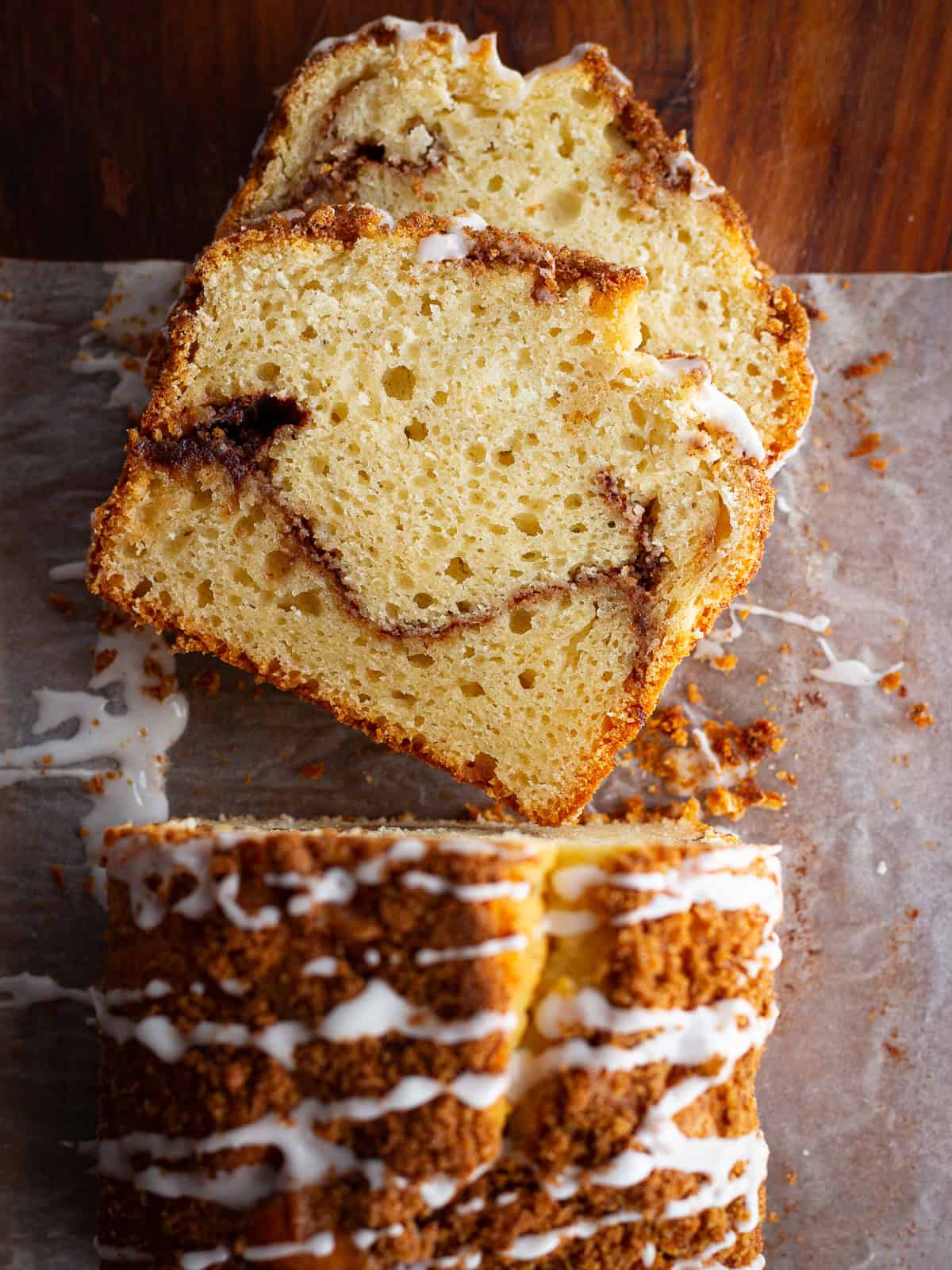 Gluten-free cinnamon swirl bread cut into slices on a cutting board.